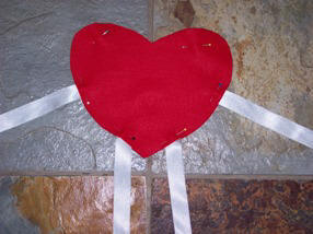 Step by step instructions for sewing a felt heart person for Valentine's Day